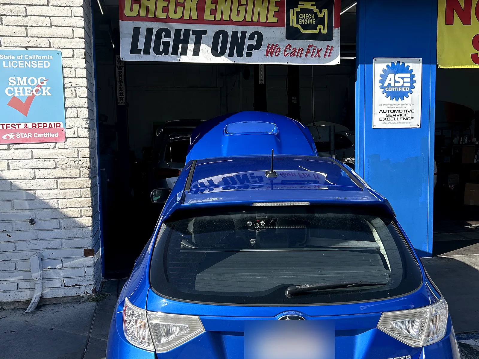 Auto electrical repair in Encinitas, CA: blue Subaru Impreza at our bay door