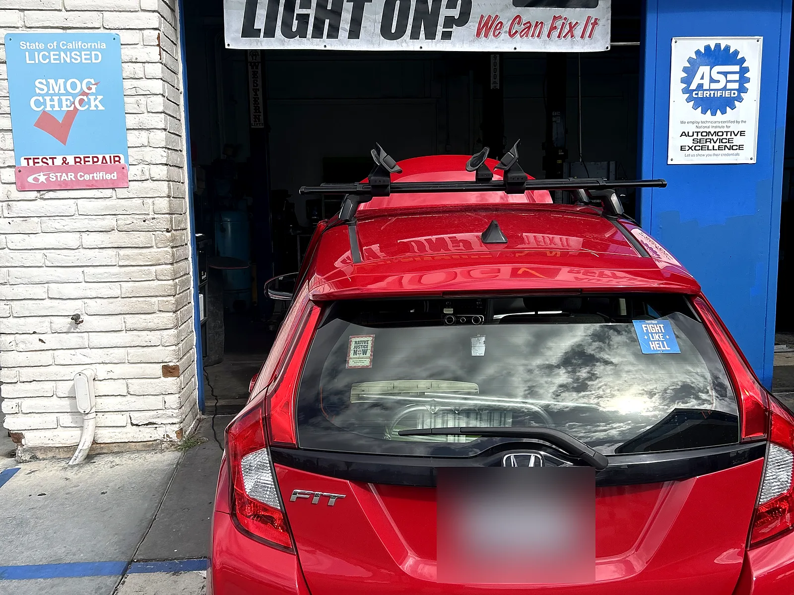 Auto electrical repair in Encinitas, CA: red Honda Fit at our service bay