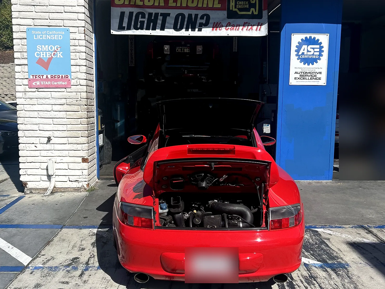 Auto repair in Encinitas, CA: Porsche 911 with the engine lid open at our bay
