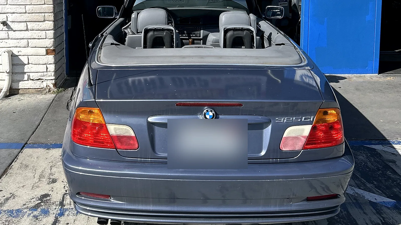European auto repair in Encinitas, CA: BMW convertible with the hood open at our bay