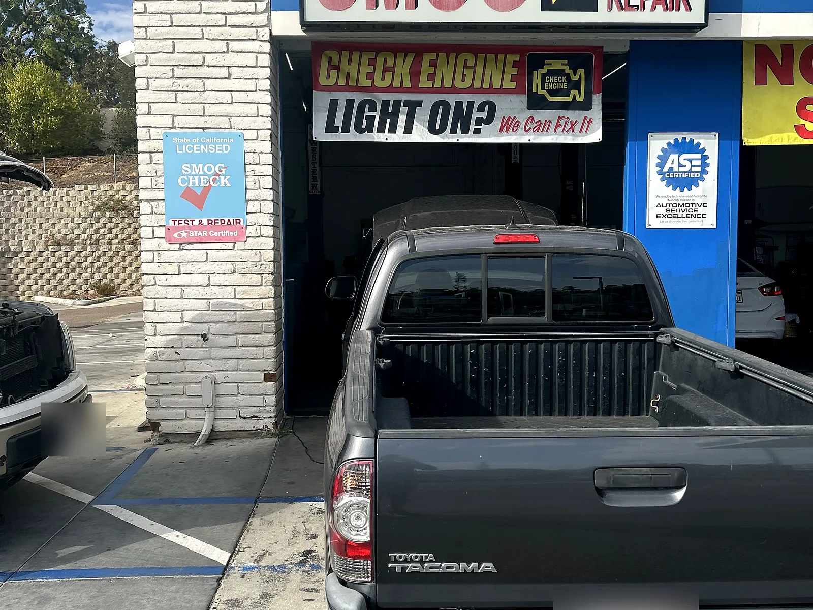 Exhaust and muffler repair in Encinitas, CA: Toyota Tacoma pickup at our bay door