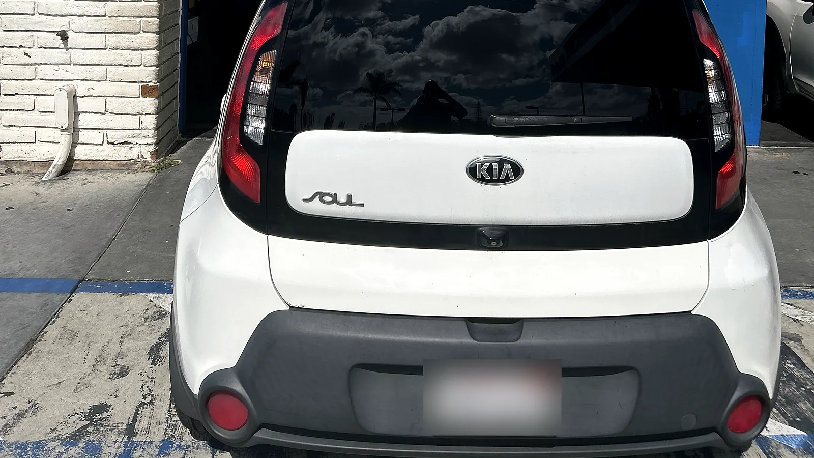 Out-of-state vehicle smog check in Encinitas, CA: white Kia Soul pulled into our test bay